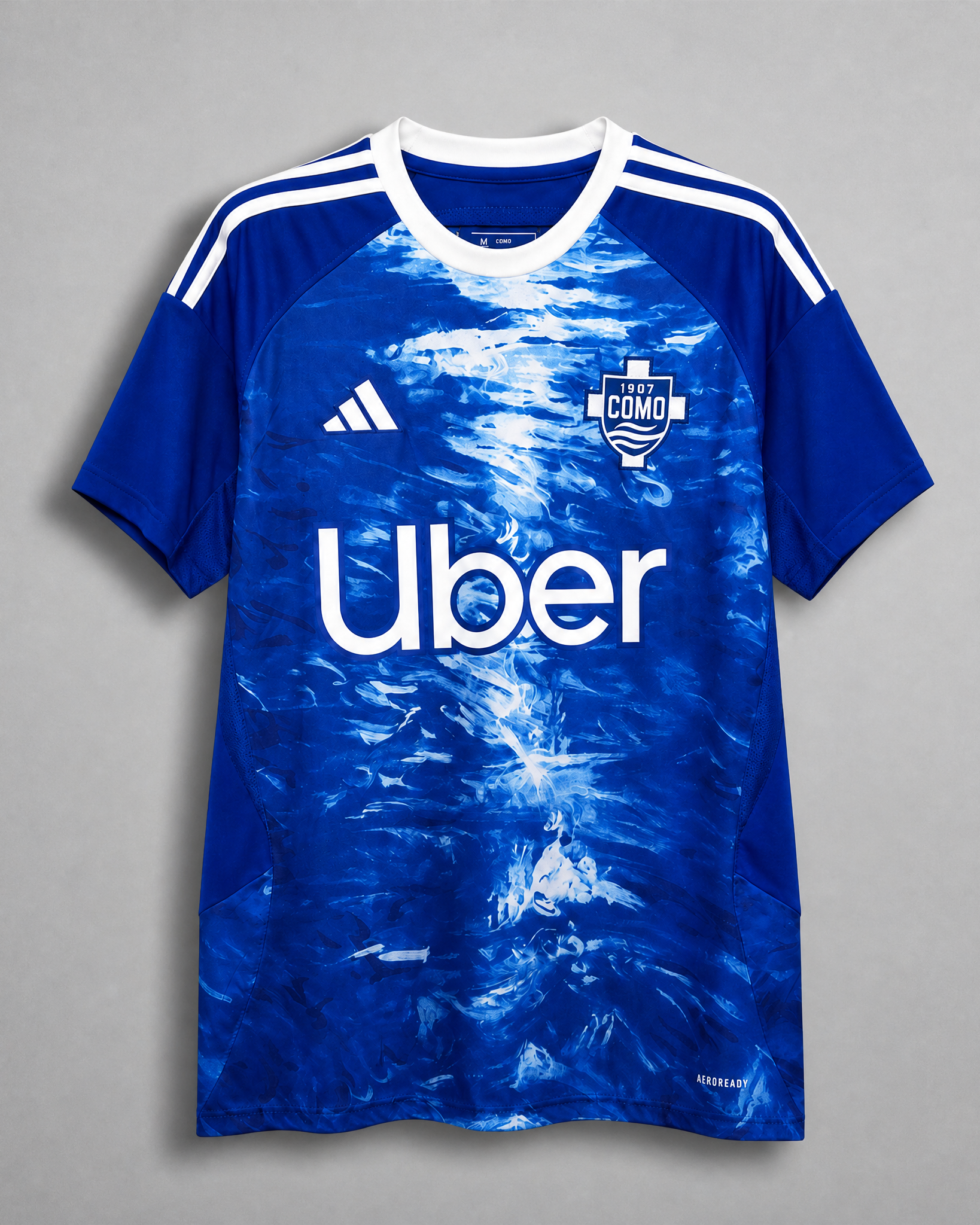 Como 1907 maglia home 2025/26 blu con grafica effetto lago