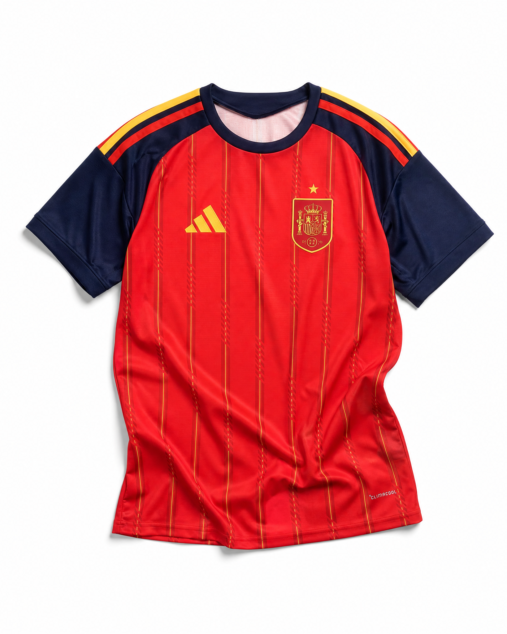 Fronte della maglia home della Spagna 2026 rossa con pannelli scuri sulle maniche e stemma sul petto