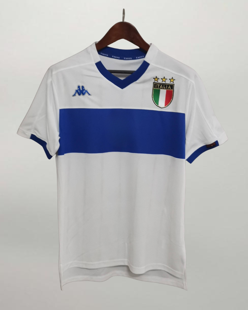 Fronte maglia away Italia 1999/00 con stemma FIGC e dettagli blu sul colletto.