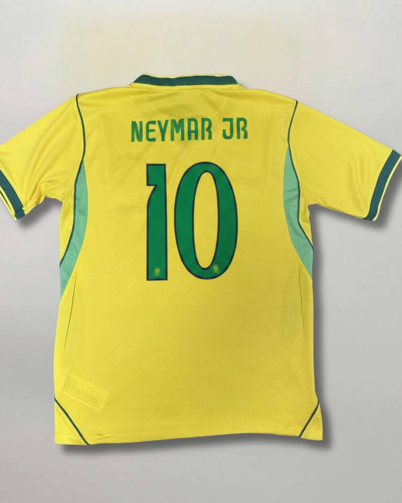 Retro della maglia gialla del Brasile 2026 con nome Neymar Jr e numero 10 verde.