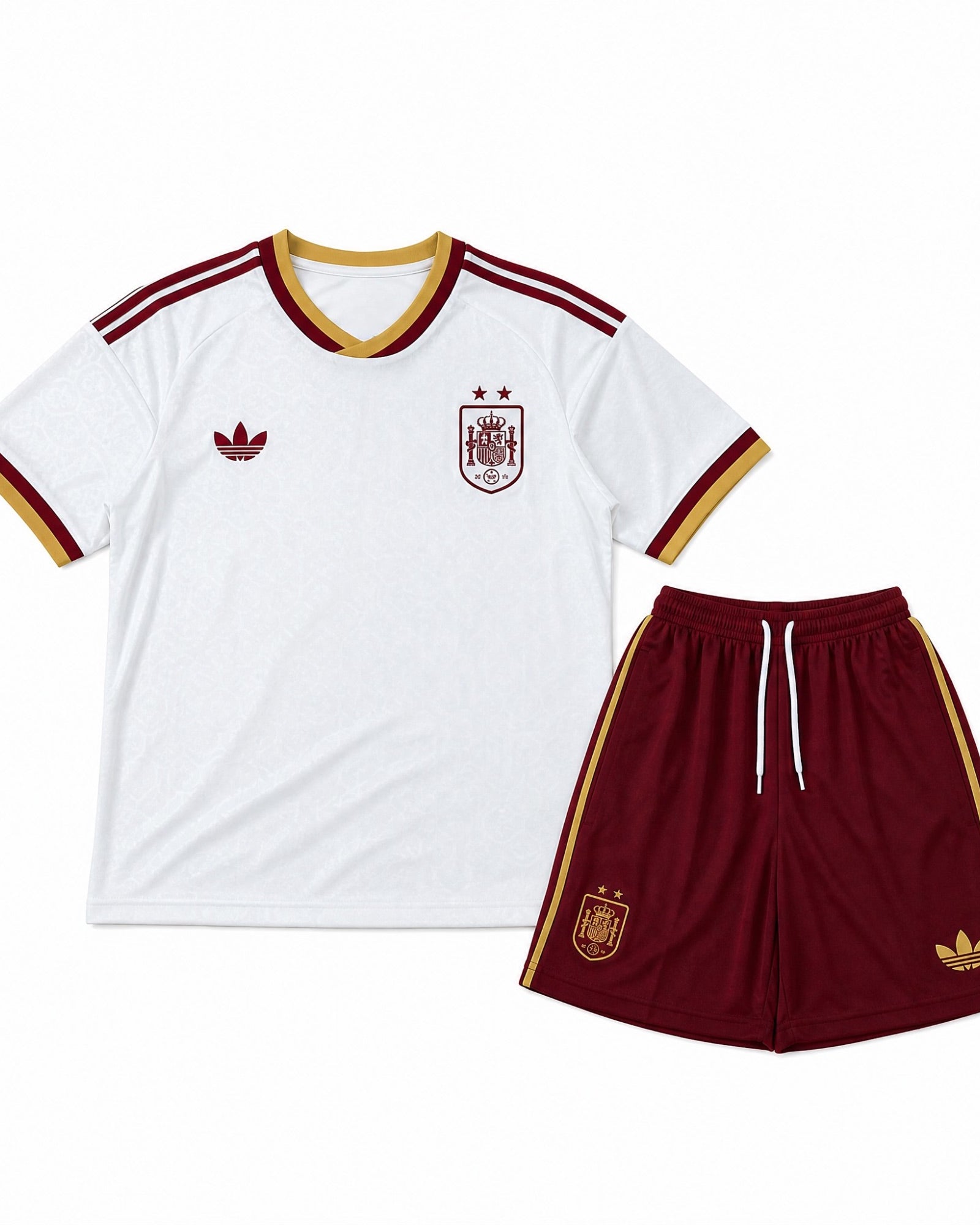 Completo Away Bambino Spagna Mondiali 2026 con maglia bianca e pantaloncini bordeaux vista frontale.