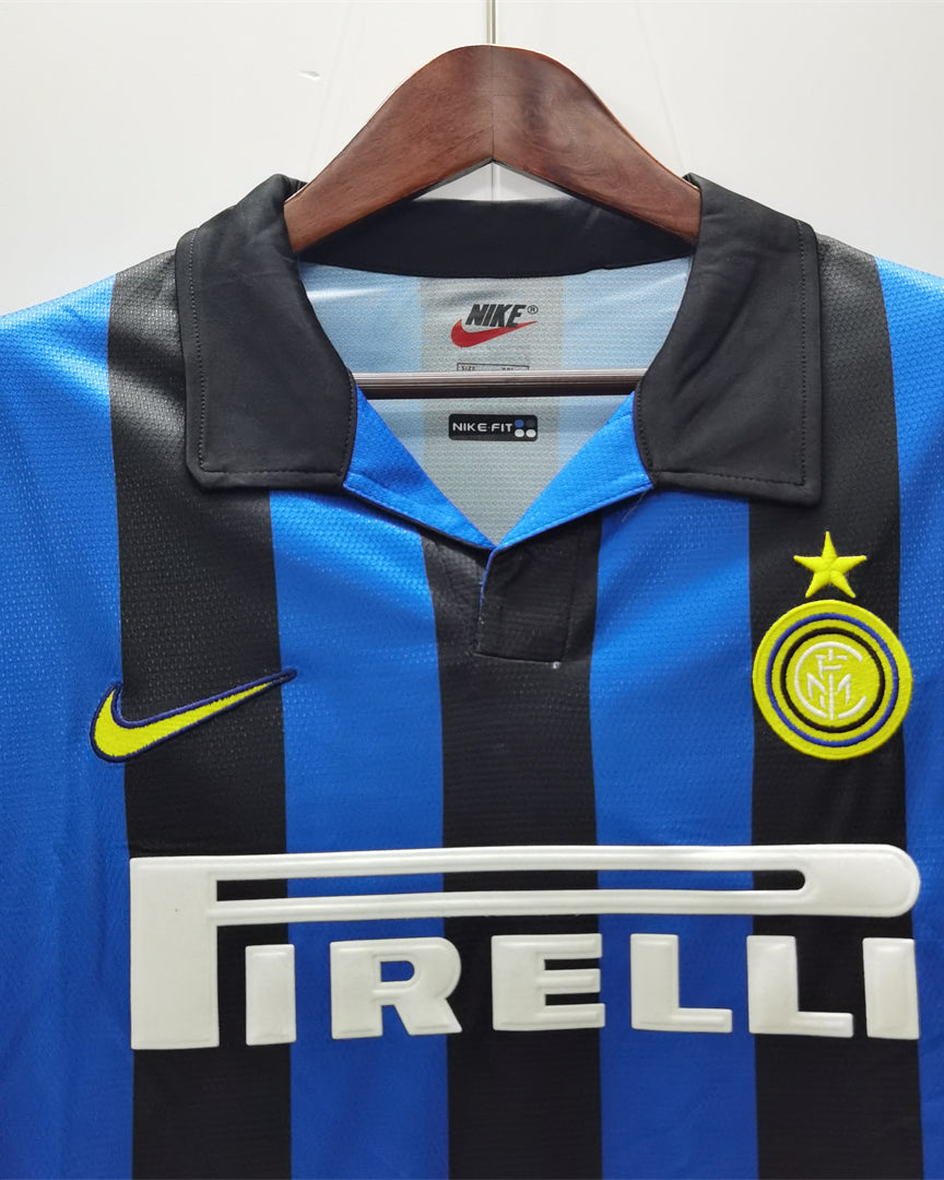 home Inter 1998/99 strisce nerazzurre, colletto a polo e stella dorata.