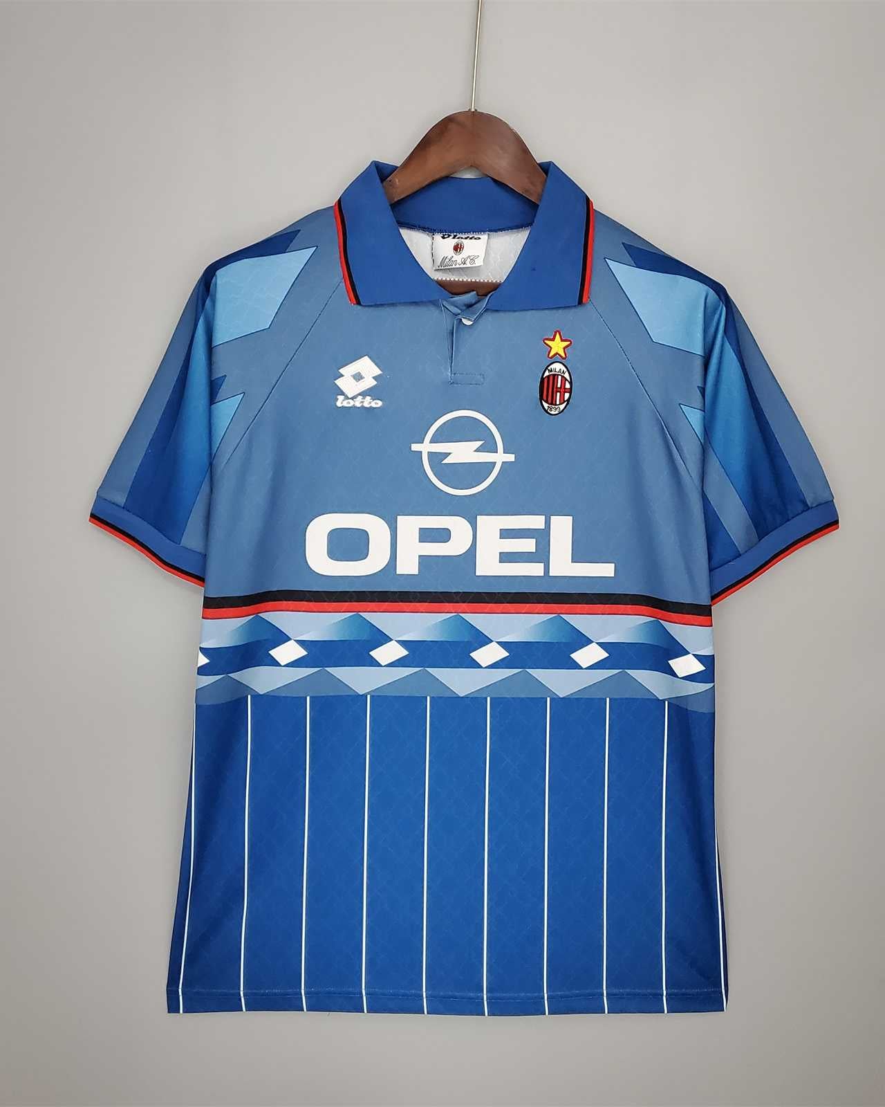 kit vintage blu Milan 1995/96 con colletto a polo e trame verticali.