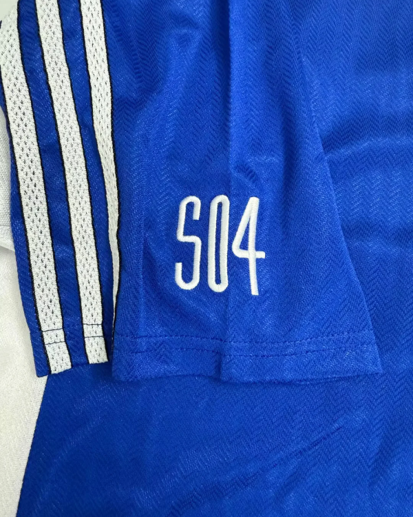 Schalke 04 jersey retrò blu con design classico Bundesliga