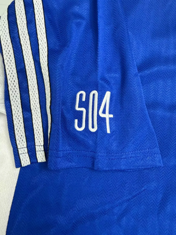 Schalke 04 jersey retrò blu con design classico Bundesliga