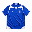 Maglia Grecia Away 2004 World Cup blu dettagli bianchi vista frontale