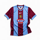Aston Villa maglia home 1999/00 con strisce bordeaux e azzurre
