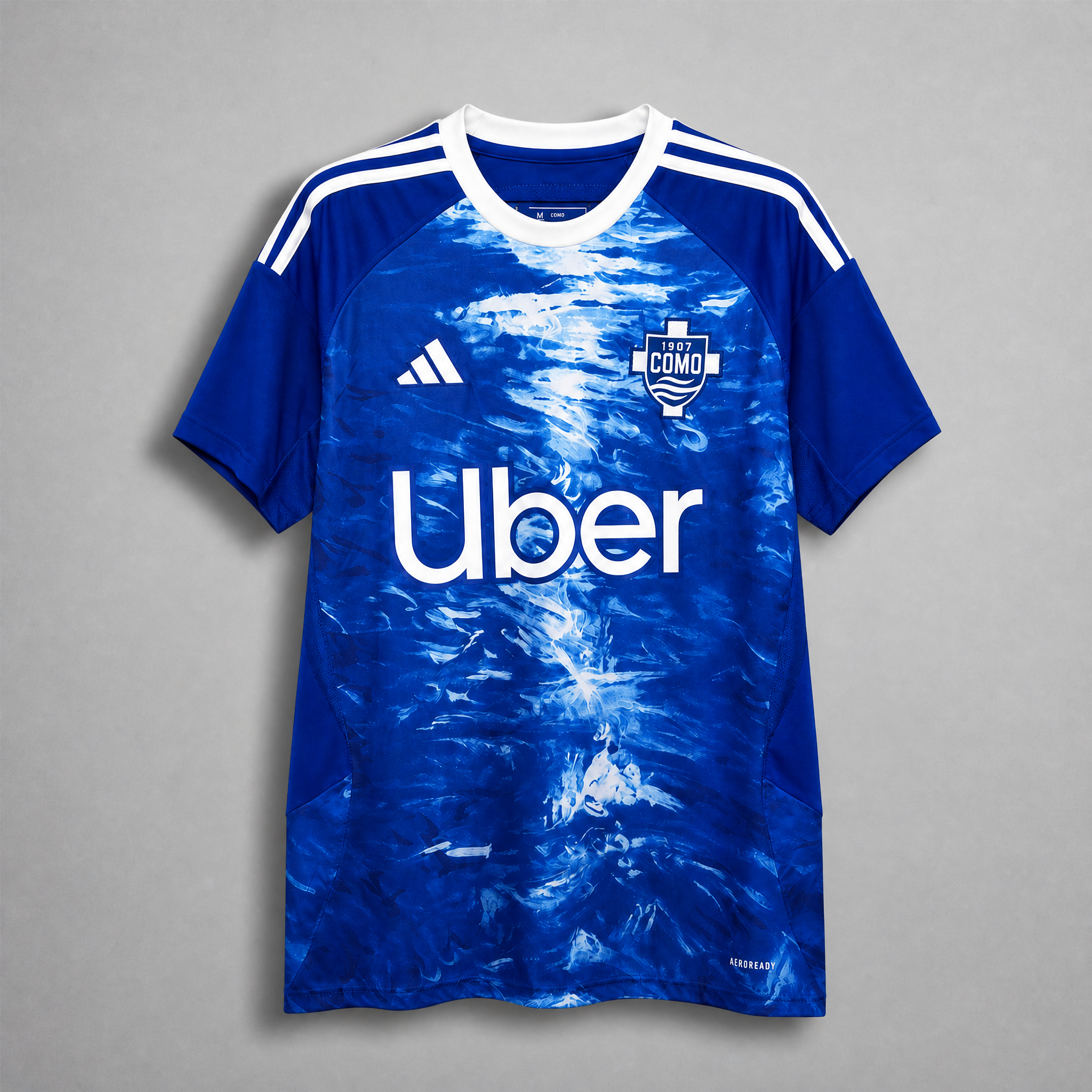 Como 1907 maglia home 2025/26 blu con grafica effetto lago
