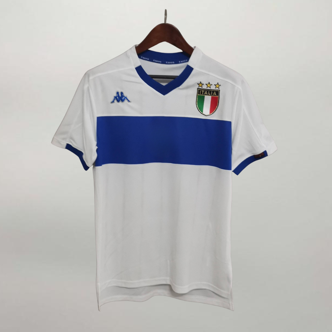 Fronte maglia away Italia 1999/00 con stemma FIGC e dettagli blu sul colletto.