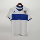 Fronte maglia away Italia 1999/00 con stemma FIGC e dettagli blu sul colletto.
