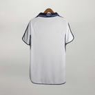 Retro maglia Real Madrid Home 2000/01 bianca con dettagli blu navy sul colletto