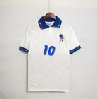 Fronte maglia away Italia 1994 con stemma FIGC e colletto tricolore.